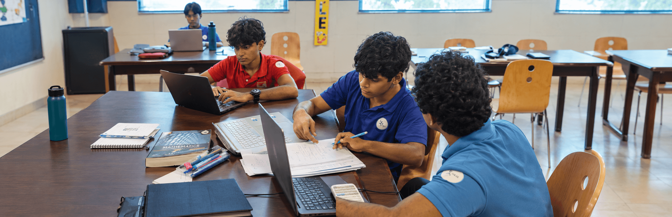 students working on ib extended essay